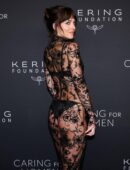 Dakota Johnson in Long Transparent Flowery Gown in Kering Foundation’s Caring for Women Dinner in New York City