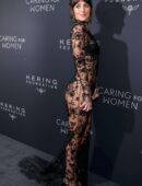Dakota Johnson in Long Transparent Flowery Gown in Kering Foundation’s Caring for Women Dinner in New York City